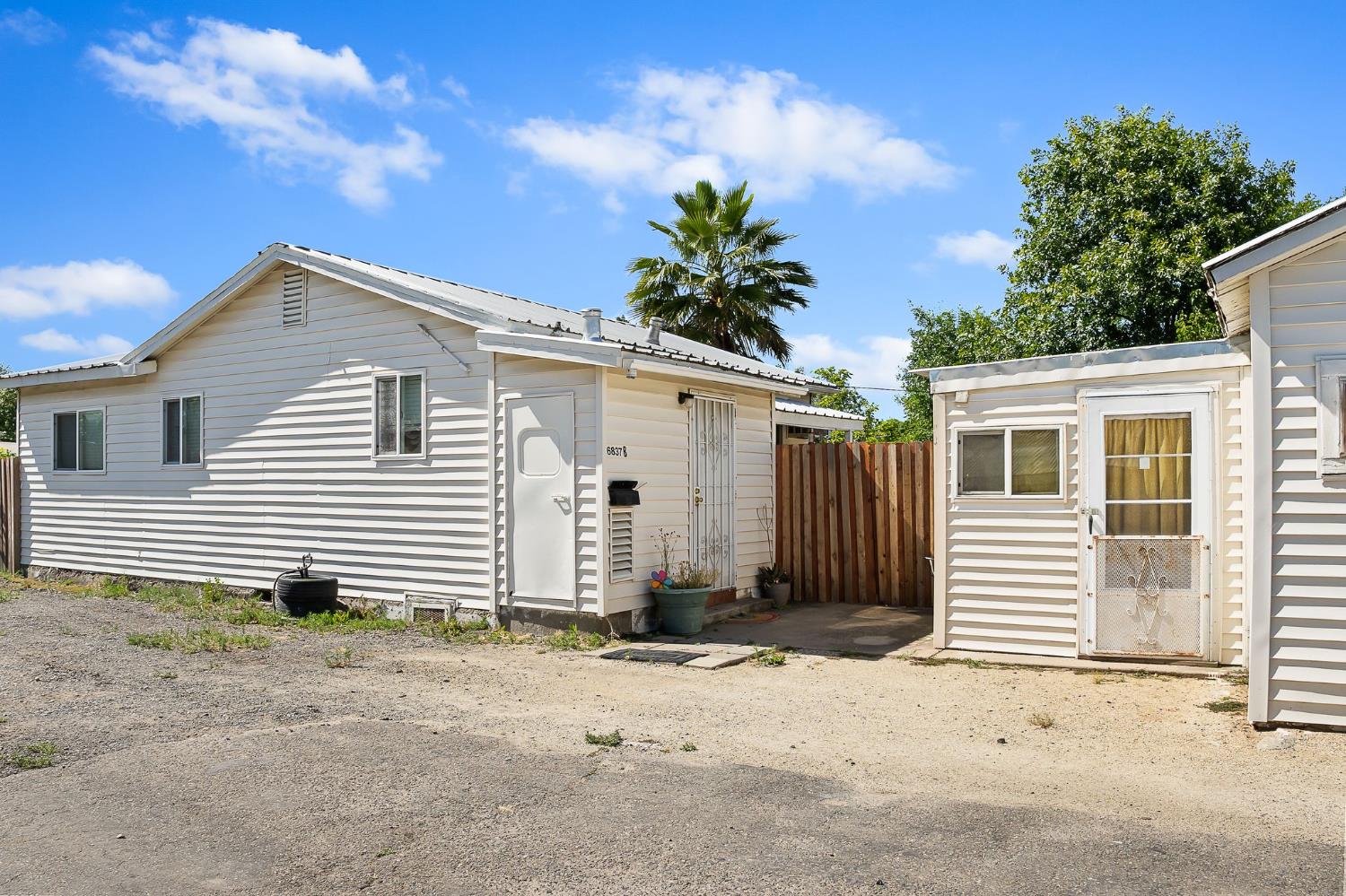 6837 Rio Linda Boulevard Rio Linda, CA 95673 - Photo 13 of 51 a front view of a house with a yard