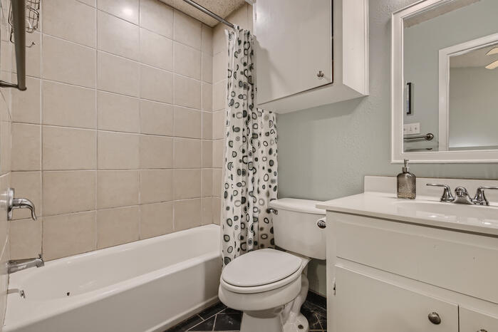 5107 Leralynn Street, Unit 304 Austin, TX 78751 - Photo 17 of 28 Full bath with toilet, shower / tub combo, and vanity