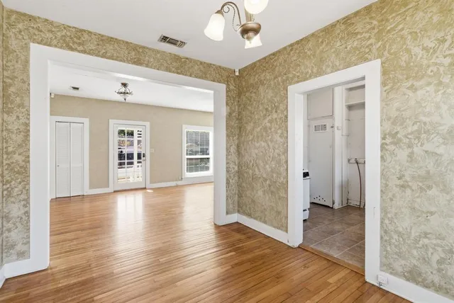 a view of cabinets a sink and a window in a room