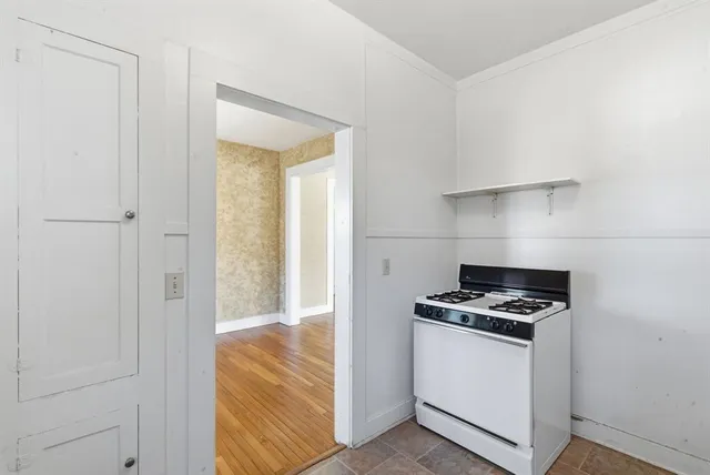 a view of a livingroom with a ceiling fan and a window
