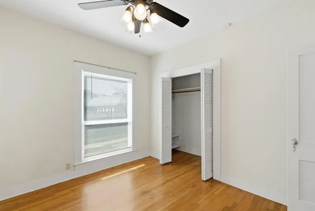 an empty room with wooden floor