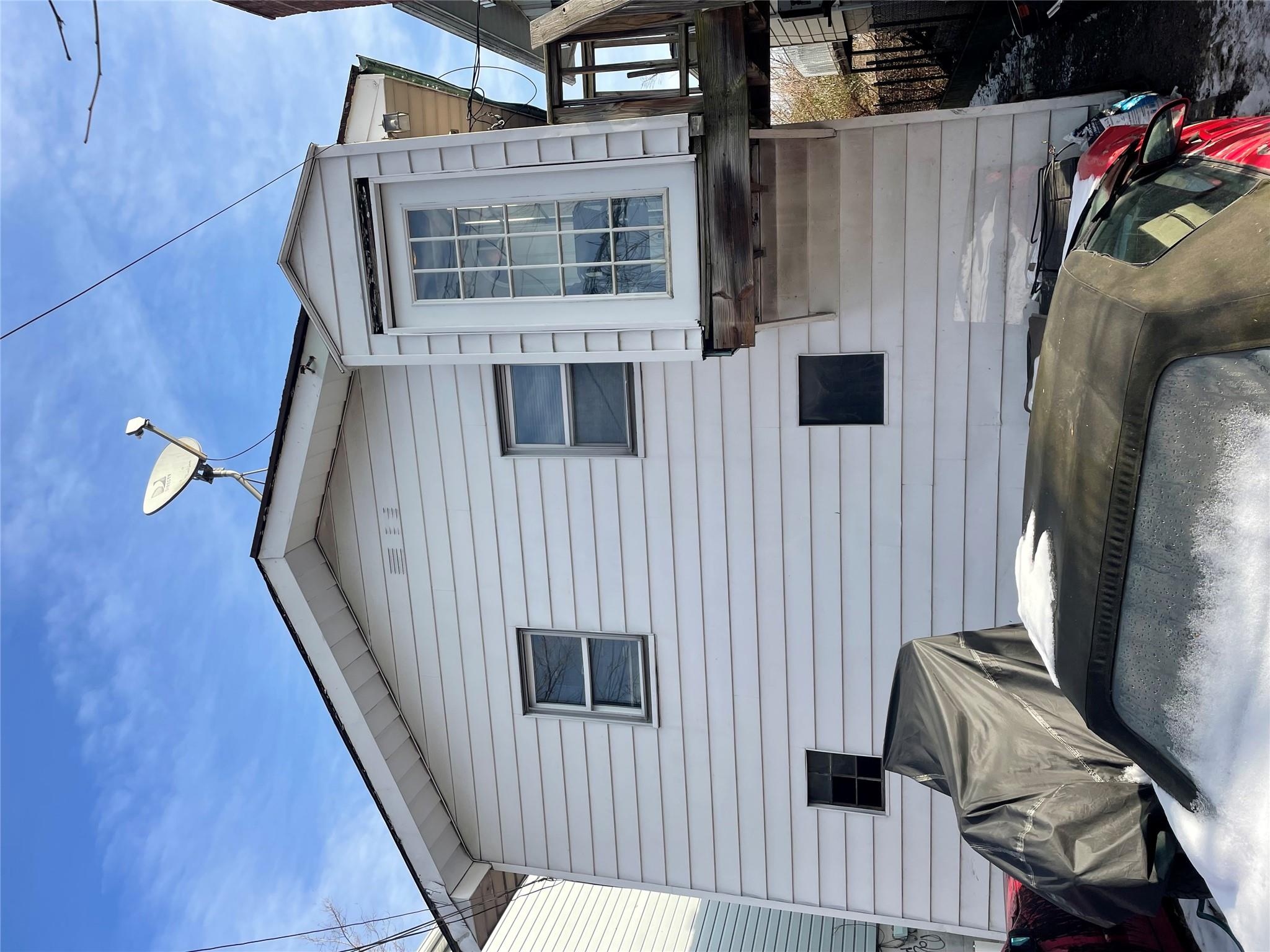 234 Betts Avenue Bronx, NY 10473 - Photo 1 of 11 a front view of a house with balcony