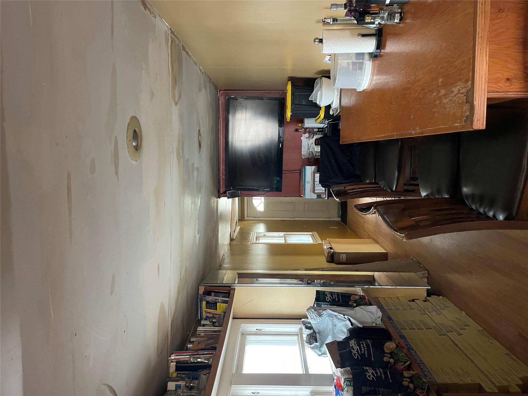 234 Betts Avenue Bronx, NY 10473 - Photo 3 of 11 a living room with furniture and a flat screen tv