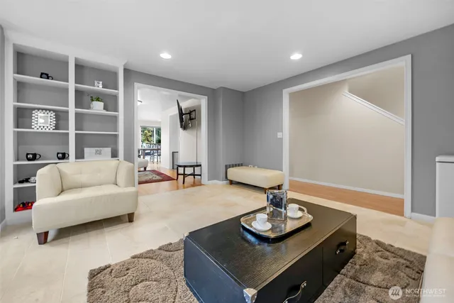 a spacious bedroom with a large bed and a dresser