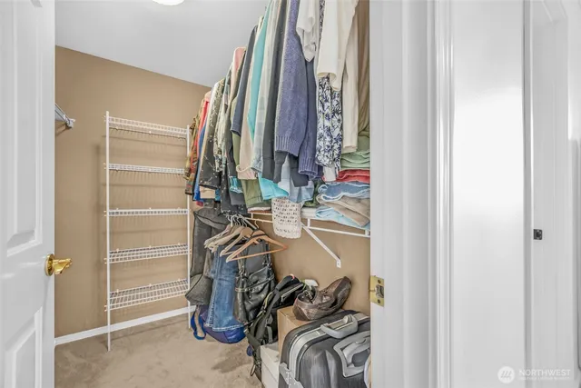 a living room with furniture gym equipment and a window