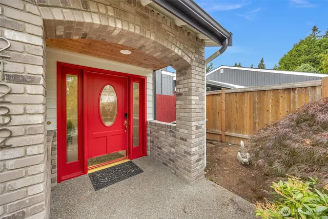 a front view of a house with red carpet