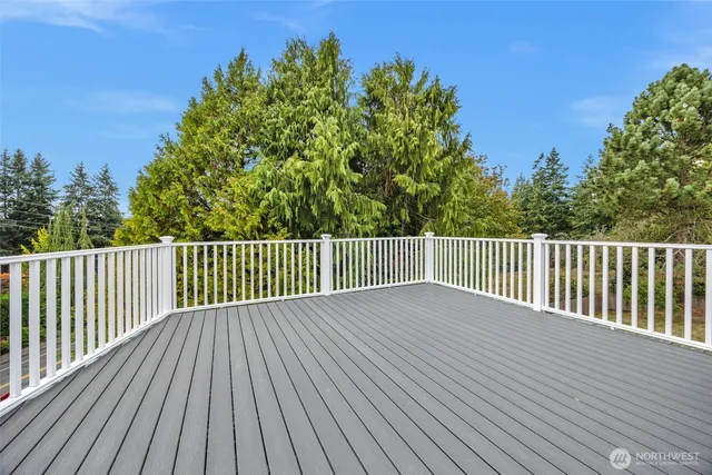 a living room with furniture a flat screen tv and a dresser