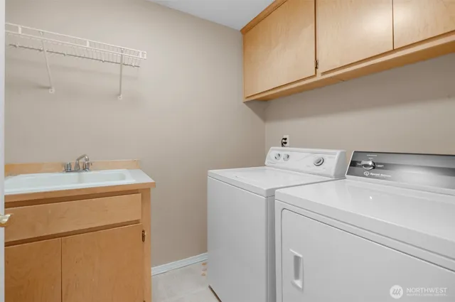 an aerial view of residential house with outdoor space and lake view