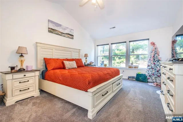 a bed room with a bed and a window