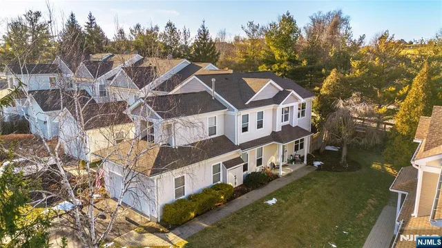 a aerial view of a house with a yard