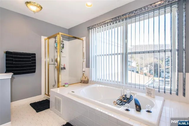 a bathroom with a bathtub and a sink
