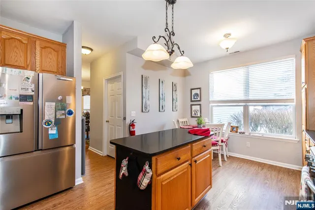 a kitchen with a table and chairs