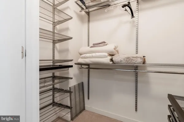a bathroom with a granite countertop sink a toilet and a shower