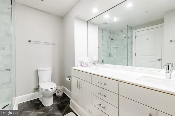 a bathroom with a shower and a toilet