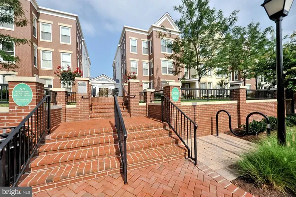 a house view with pool and sitting area
