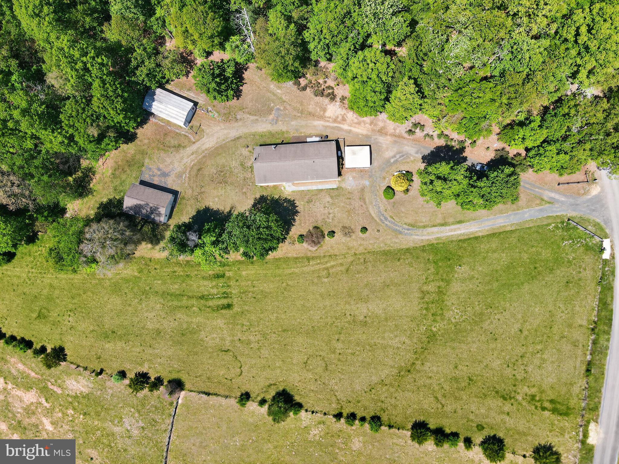 178 Lizzie Mills Road Castleton, VA 22716 - Photo 12 of 40 an aerial view of residential house with swimming pool and large trees