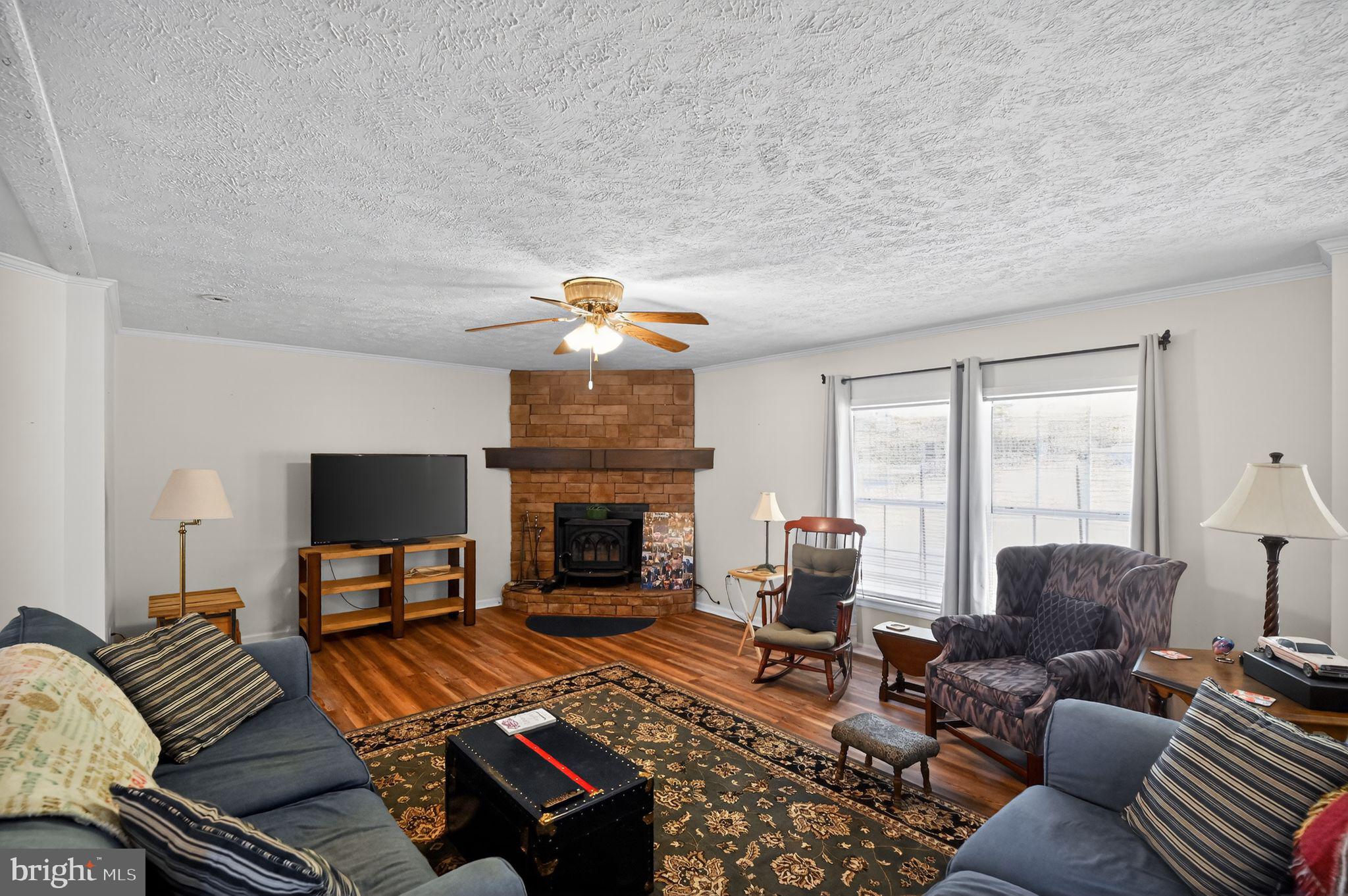 178 Lizzie Mills Road Castleton, VA 22716 - Photo 21 of 40 a living room with furniture and a fireplace