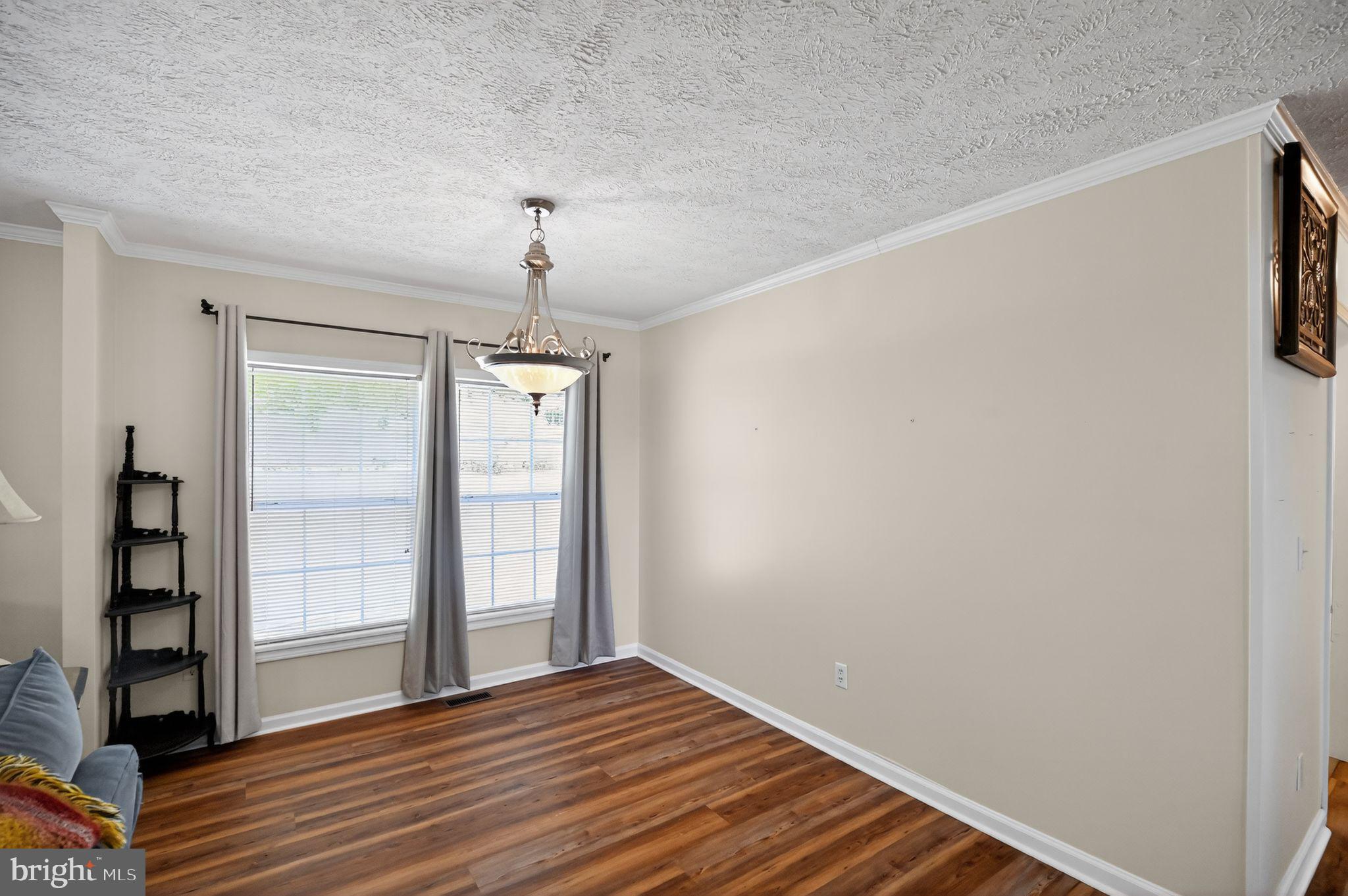 178 Lizzie Mills Road Castleton, VA 22716 - Photo 31 of 40 a view of an empty room with wooden floor and a window