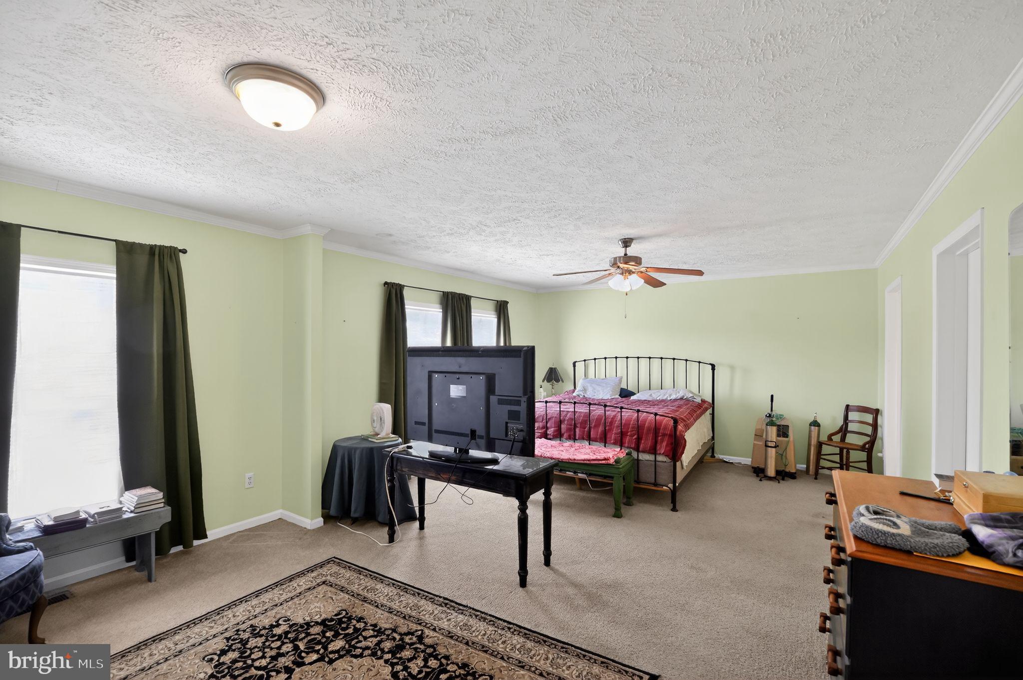 178 Lizzie Mills Road Castleton, VA 22716 - Photo 32 of 40 a bedroom with furniture and a window