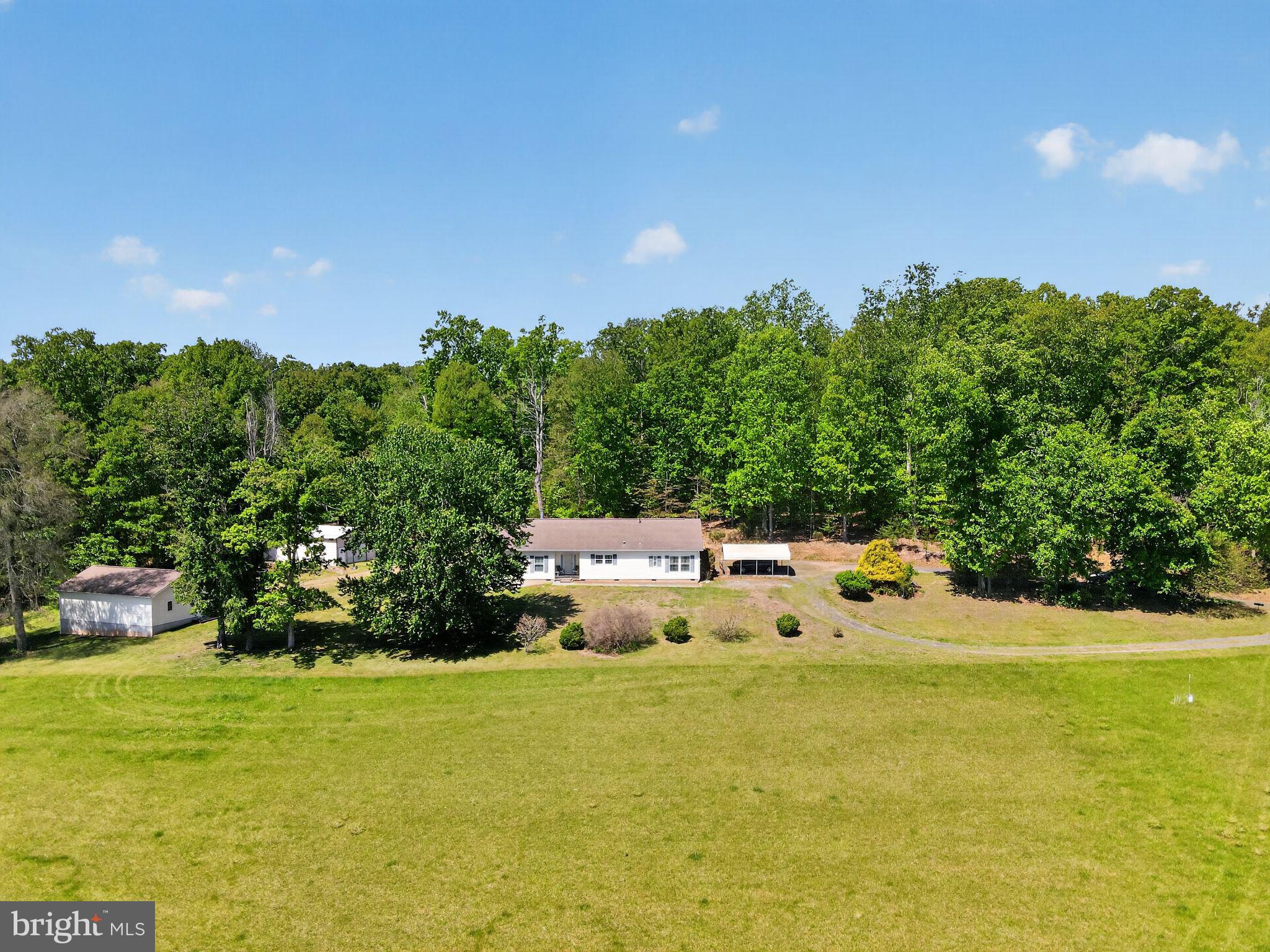 178 Lizzie Mills Road Castleton, VA 22716 - Photo 4 of 40 a view of a swimming pool with an outdoor space and seating area