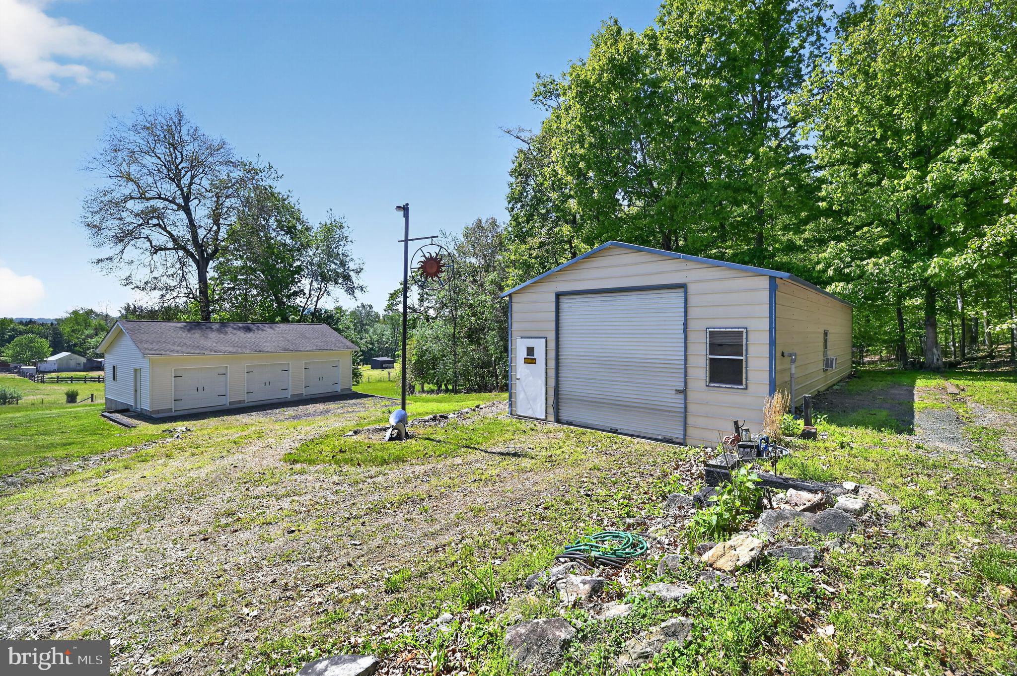 178 Lizzie Mills Road Castleton, VA 22716 - Photo 6 of 40 a backyard of a house with plants and large tree