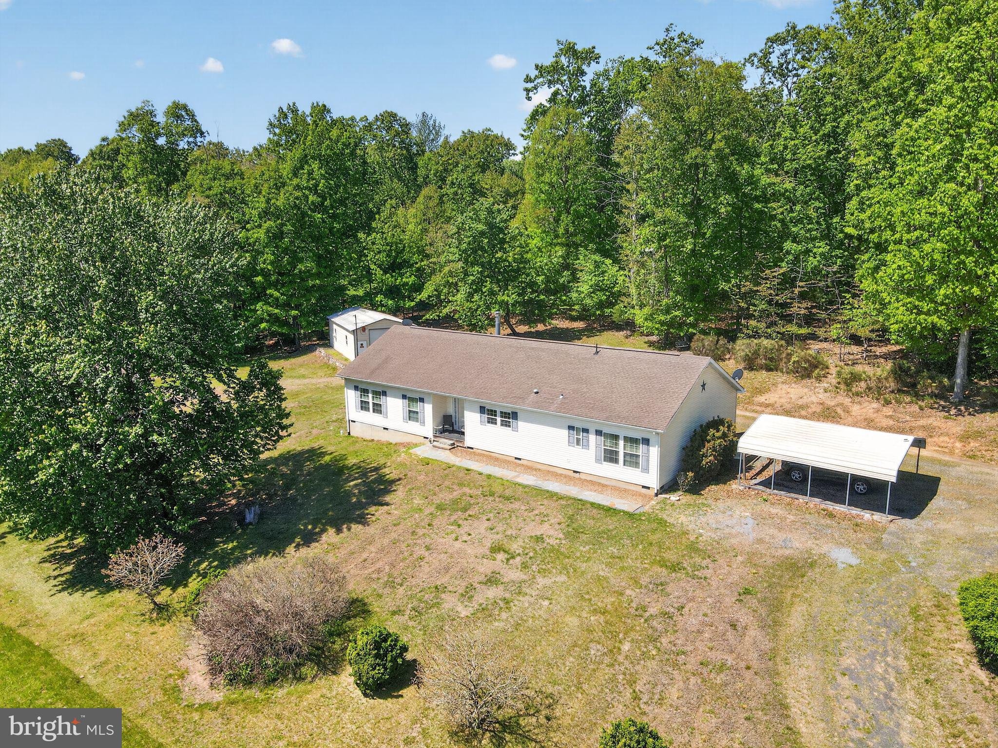 178 Lizzie Mills Road Castleton, VA 22716 - Photo 9 of 40 a view of a house with a yard and sitting area