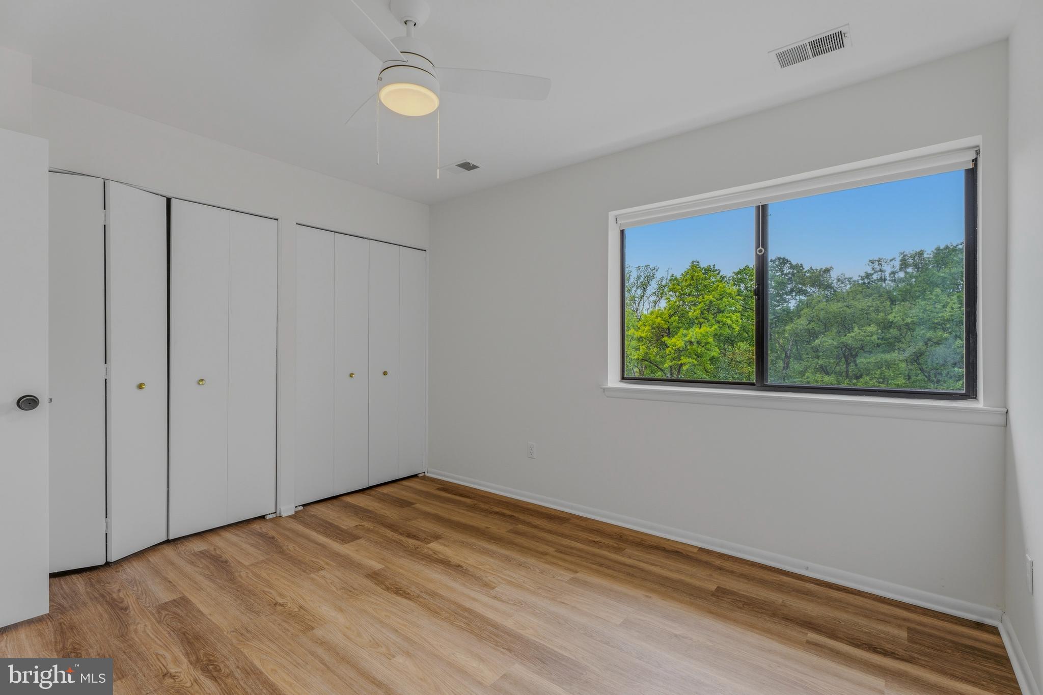 10604 Partridge Lane, Unit C3 Cockeysville, MD 21030 - Photo 12 of 23 a view of empty room with wooden floor and fan
