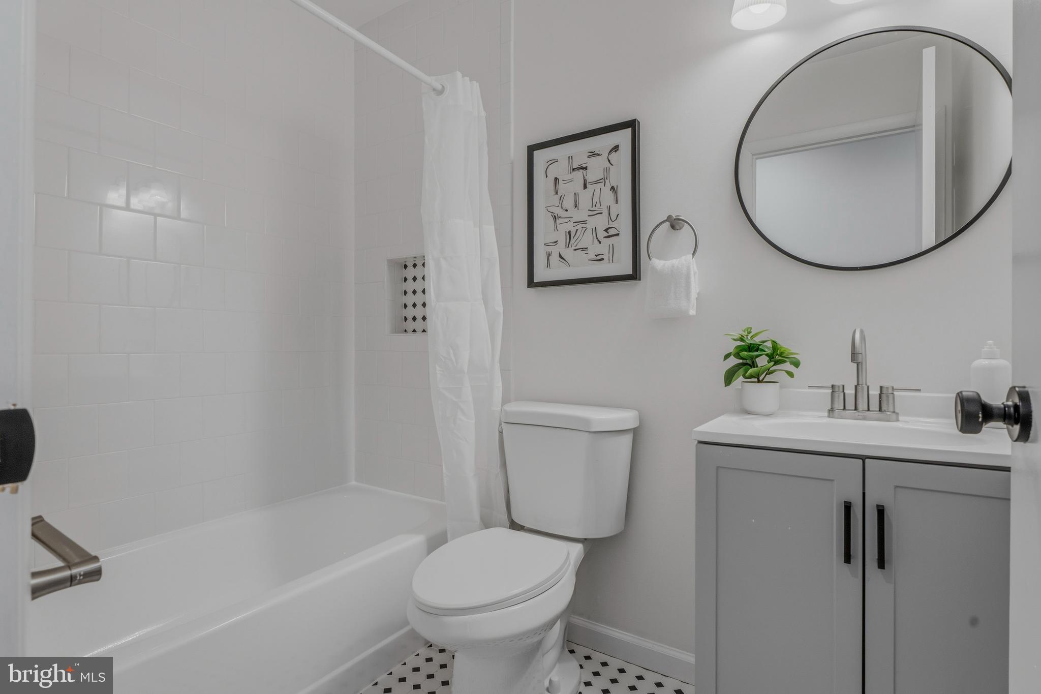 10604 Partridge Lane, Unit C3 Cockeysville, MD 21030 - Photo 13 of 23 a bathroom with a sink toilet and a mirror