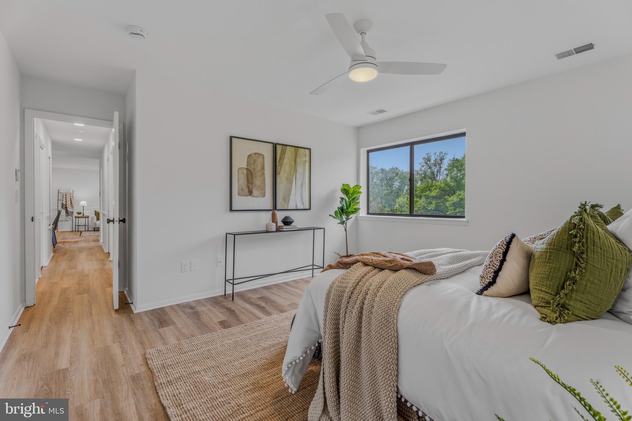10604 Partridge Lane, Unit C3 Cockeysville, MD 21030 - Photo 18 of 23 a bedroom with a bed and a chandelier
