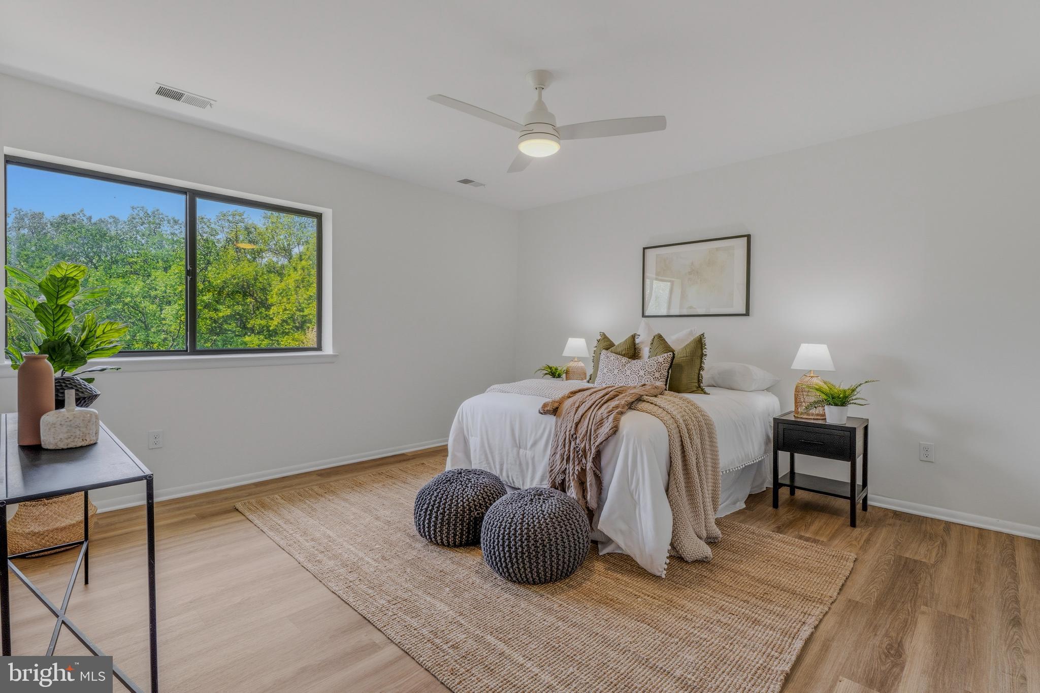 10604 Partridge Lane, Unit C3 Cockeysville, MD 21030 - Photo 19 of 23 a bedroom with a bed and a large window