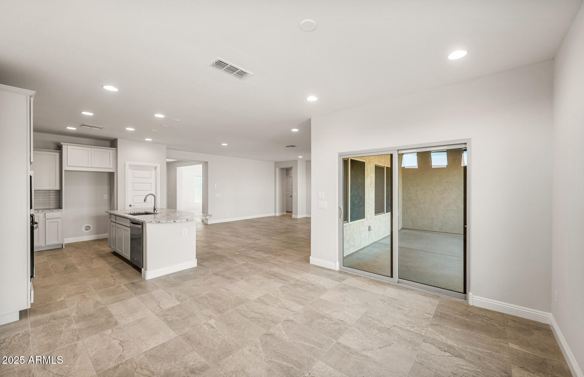 6694 West Ripken Way Florence, AZ 85132 - Photo 17 of 37 a view of a kitchen with refrigerator and wooden floor