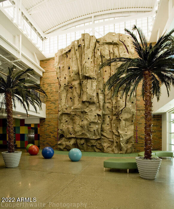6694 West Ripken Way Florence, AZ 85132 - Photo 30 of 37 a view of a patio with table and chairs and potted plants