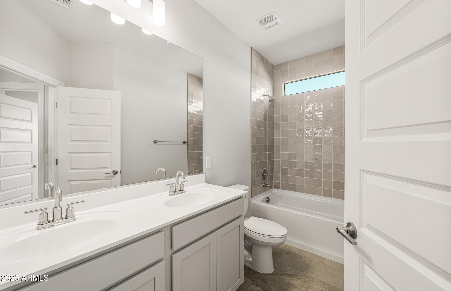6694 West Ripken Way Florence, AZ 85132 - Photo 3 of 37 a bathroom with a granite countertop sink toilet tub and shower