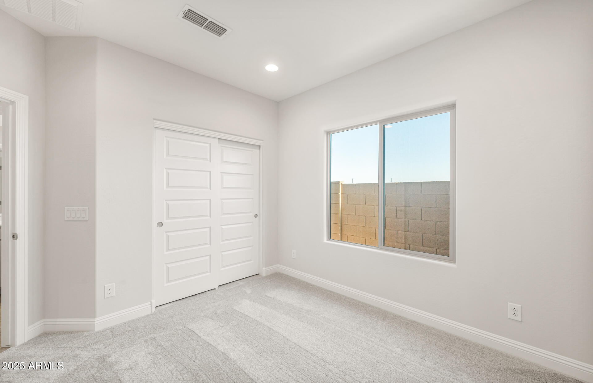6694 West Ripken Way Florence, AZ 85132 - Photo 4 of 37 an empty room with windows