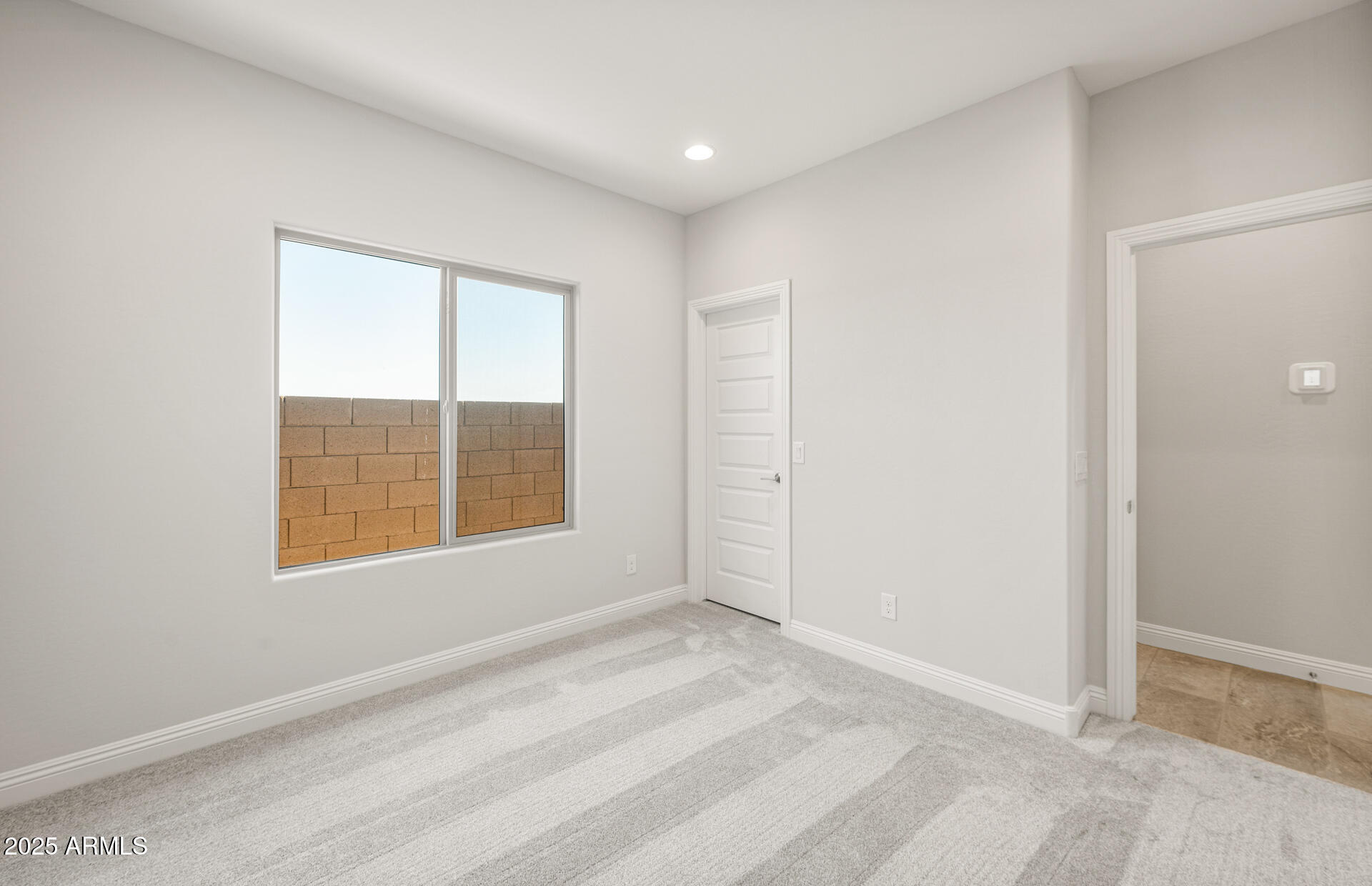 6694 West Ripken Way Florence, AZ 85132 - Photo 6 of 37 a view of an empty room with a window