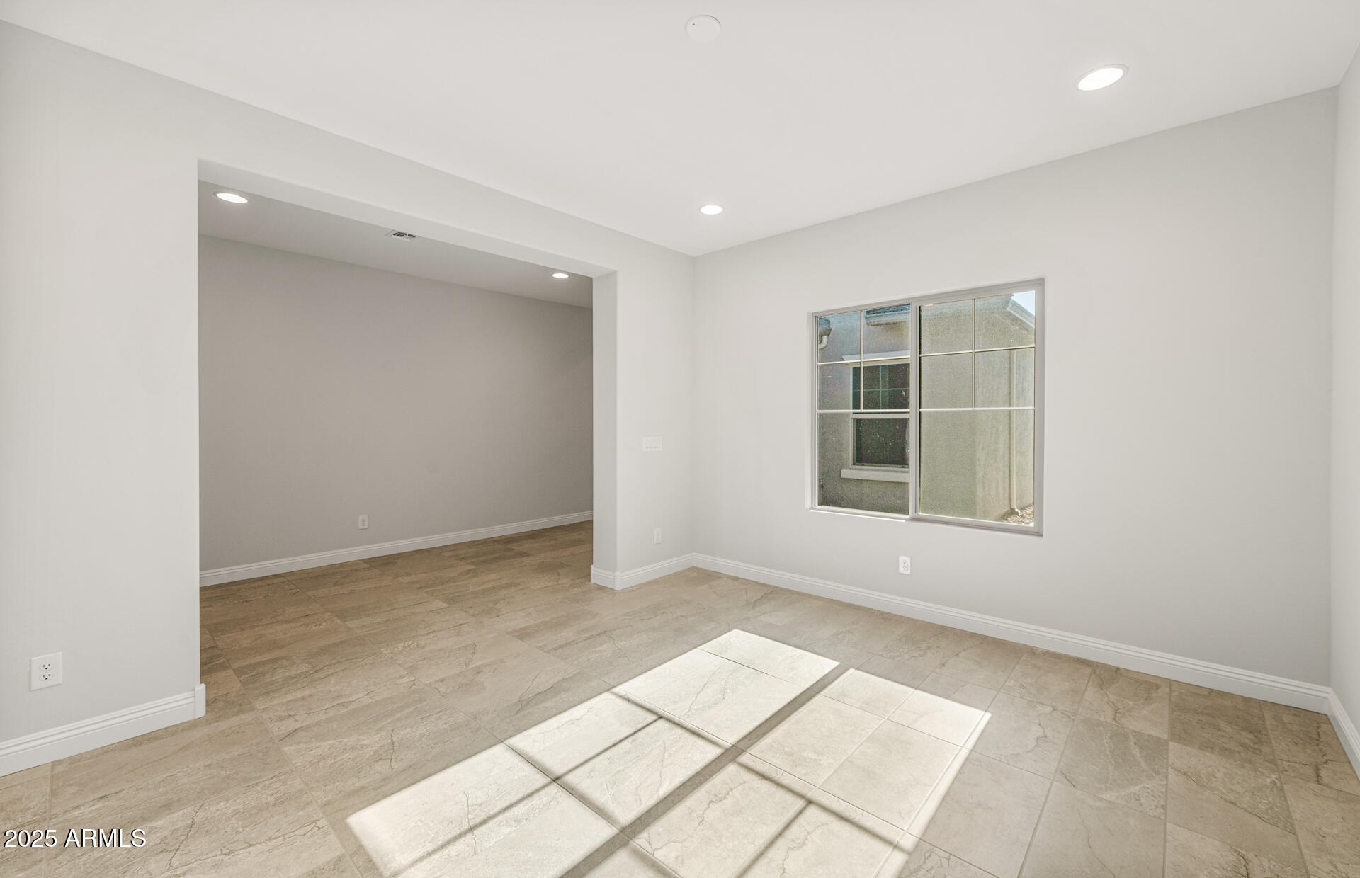 6694 West Ripken Way Florence, AZ 85132 - Photo 7 of 37 an empty room with windows