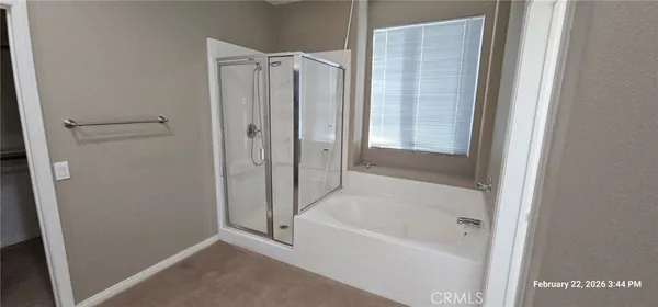 a bathroom with a bathtub and toilet
