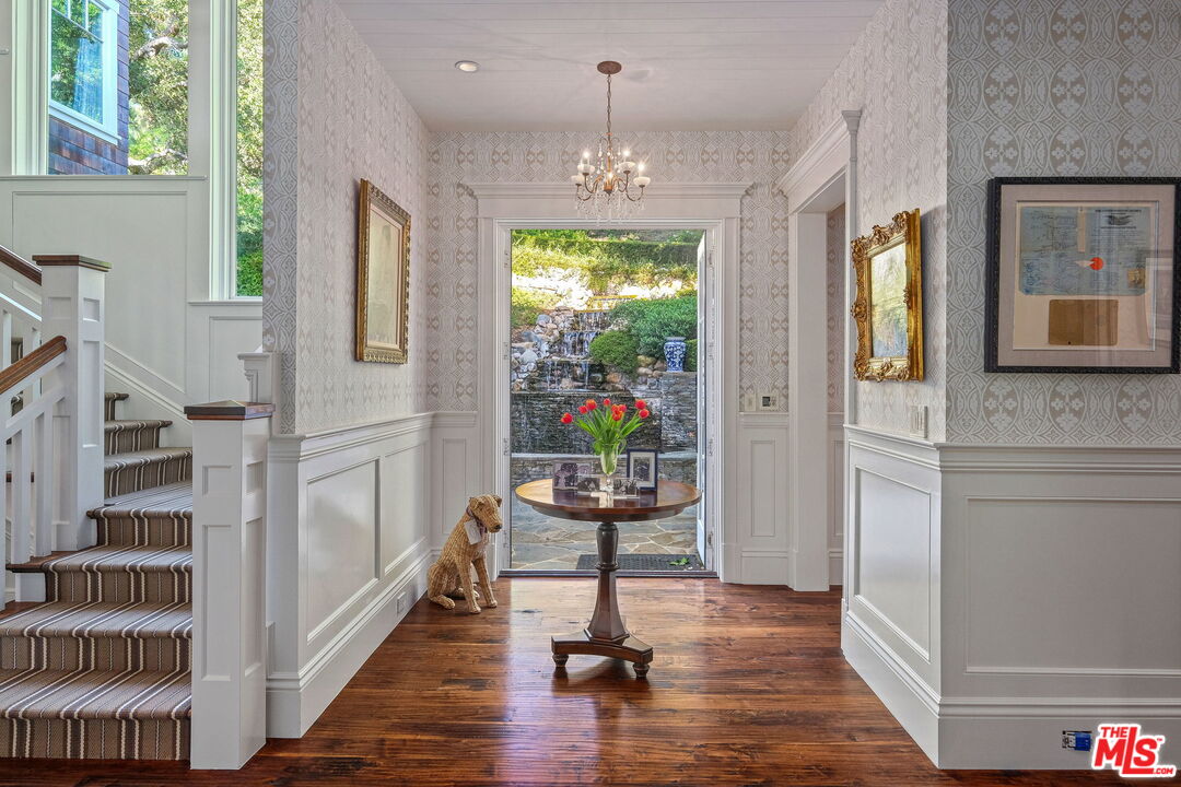 14100 Rustic Lane Pacific Palisades, CA 90272 - Photo 16 of 46 a very nice looking room with many windows and furniture