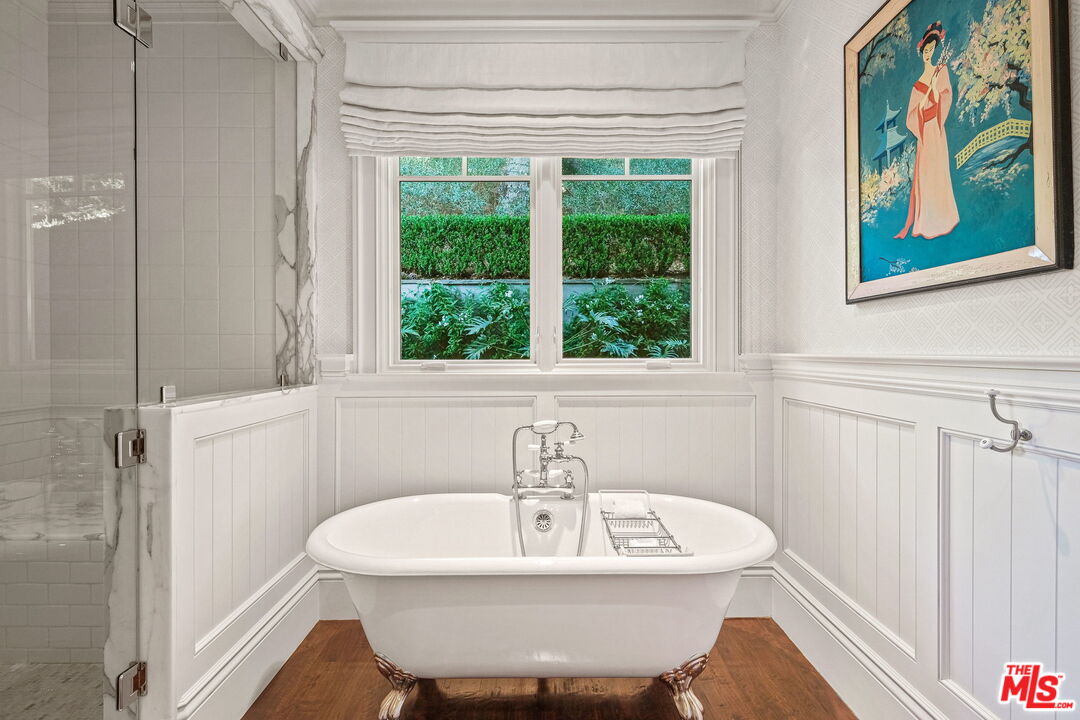 14100 Rustic Lane Pacific Palisades, CA 90272 - Photo 19 of 46 a bathroom with a sink and a bathtub