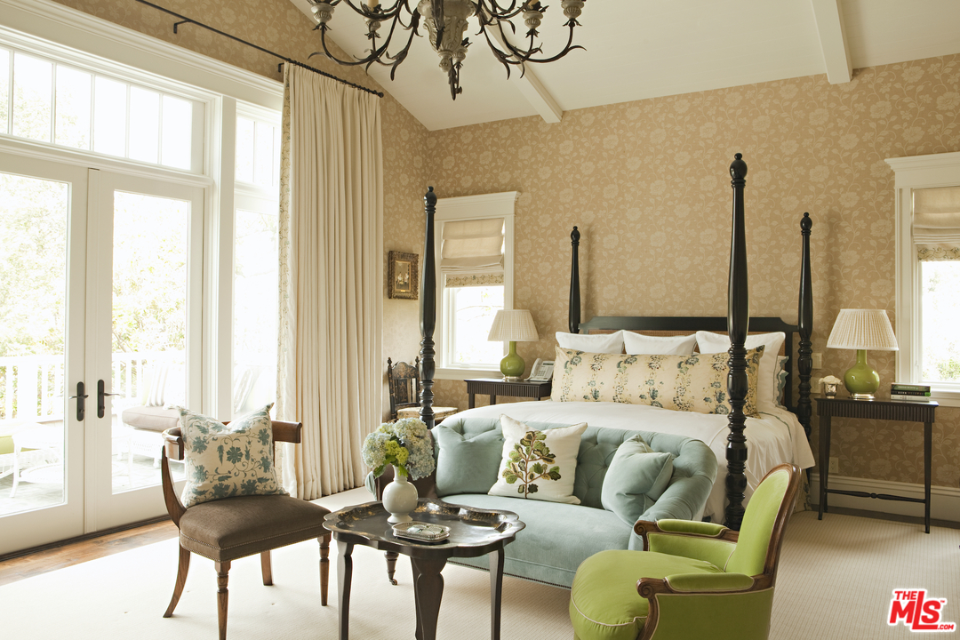 14100 Rustic Lane Pacific Palisades, CA 90272 - Photo 23 of 46 a living room with furniture and a large window