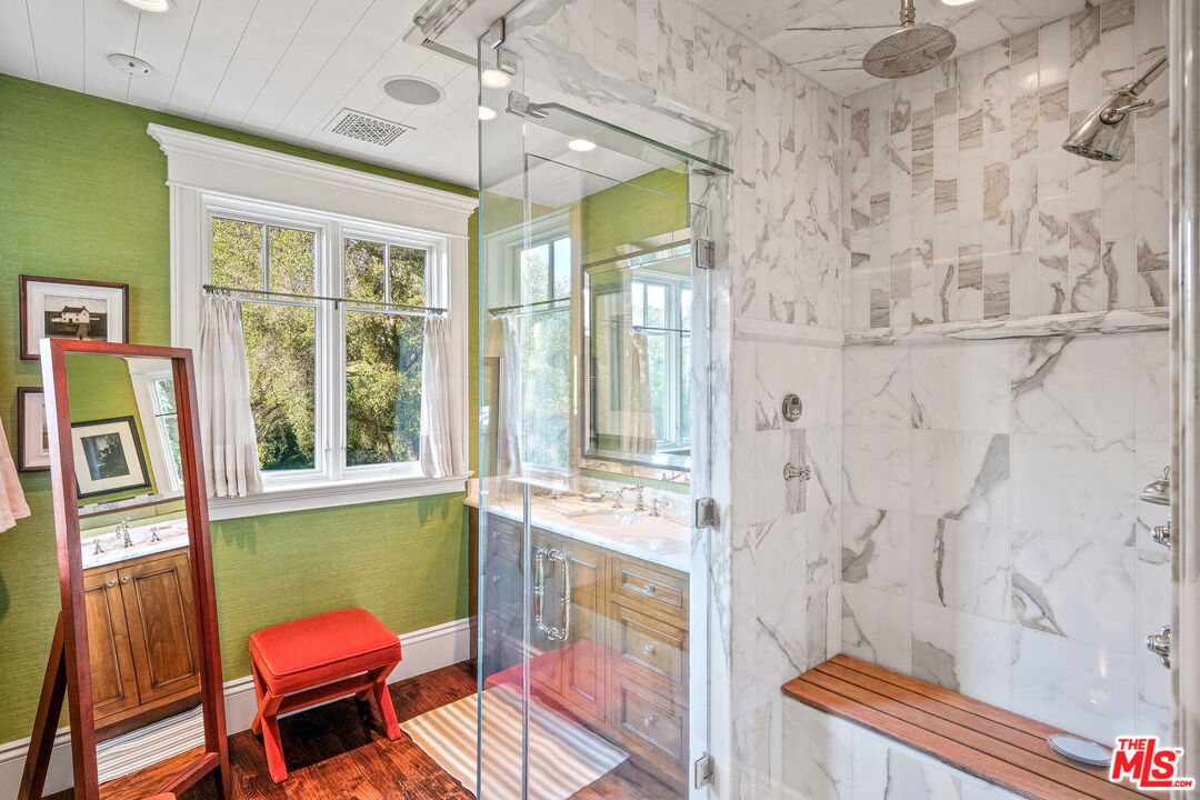 14100 Rustic Lane Pacific Palisades, CA 90272 - Photo 26 of 46 a living room with furniture and a window