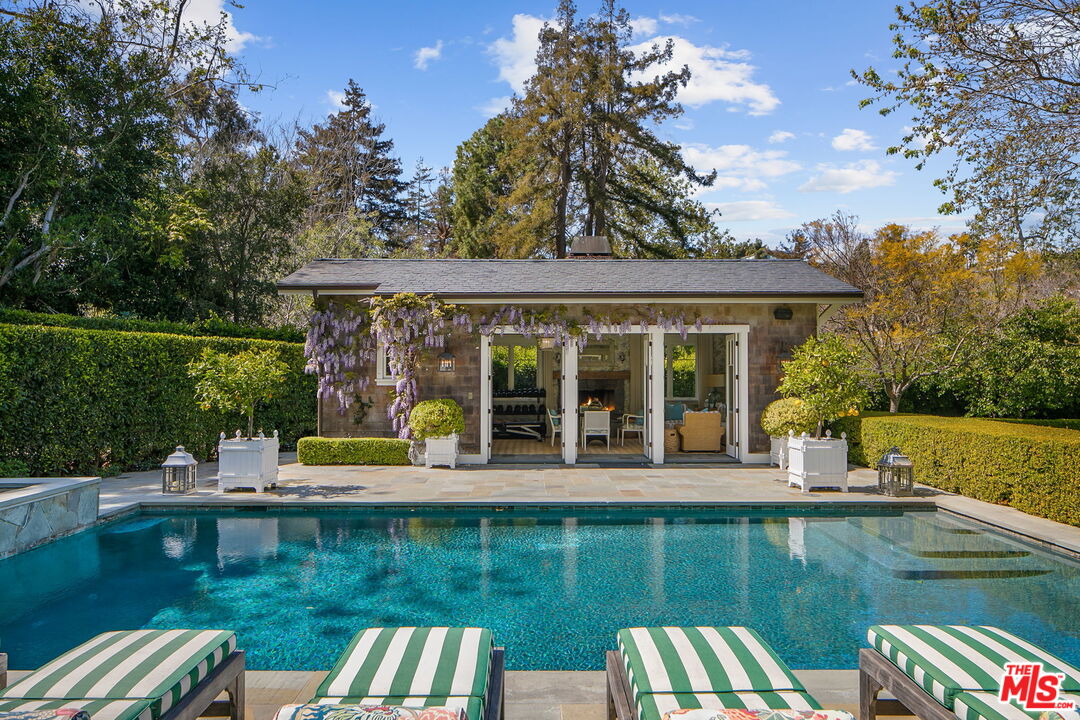 14100 Rustic Lane Pacific Palisades, CA 90272 - Photo 29 of 46 swimming pool view with a seating space