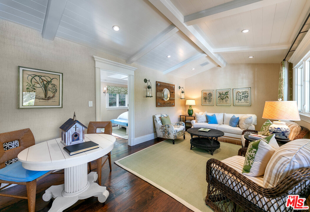 14100 Rustic Lane Pacific Palisades, CA 90272 - Photo 34 of 46 a living room with furniture and wooden floor