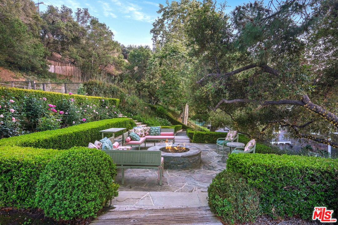 14100 Rustic Lane Pacific Palisades, CA 90272 - Photo 36 of 46 a view of a garden with patio