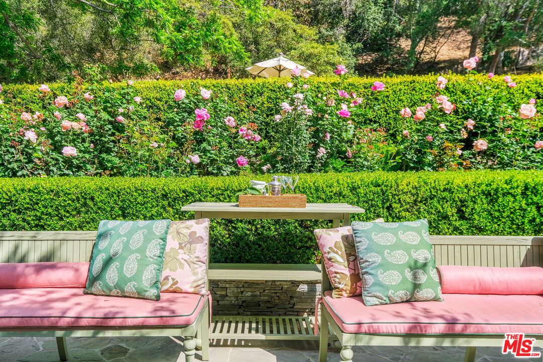 14100 Rustic Lane Pacific Palisades, CA 90272 - Photo 37 of 46 a view of yard with seating area and green space