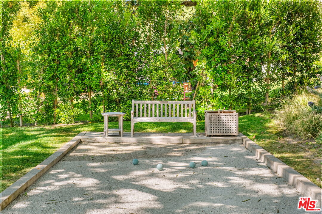 14100 Rustic Lane Pacific Palisades, CA 90272 - Photo 43 of 46 a view of a park with a bench and trees