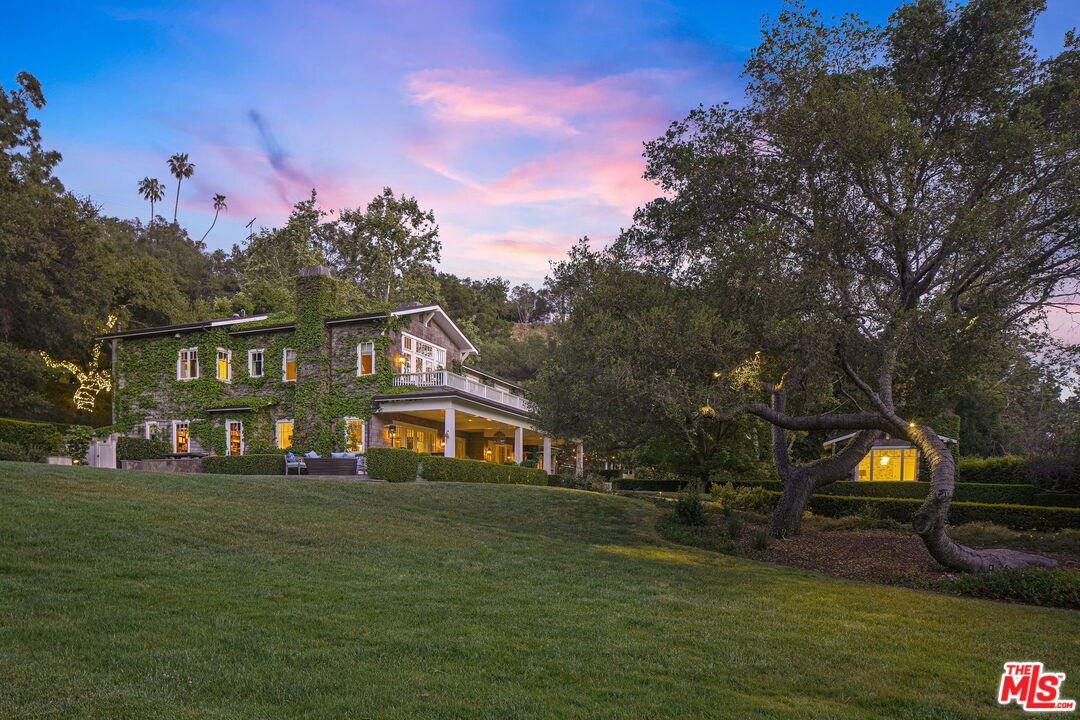 14100 Rustic Lane Pacific Palisades, CA 90272 - Photo 45 of 46 a front view of a house with garden