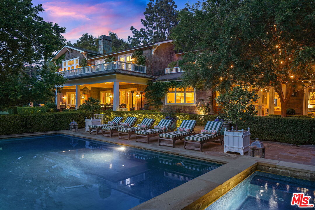 14100 Rustic Lane Pacific Palisades, CA 90272 - Photo 46 of 46 a view of a swimming pool with a patio