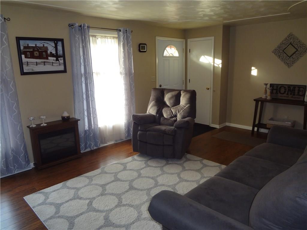 167 Town Country Road Vanderbilt, PA 15486 - Photo 3 of 25 Living Room has plenty of natural light, beautiful laminate flooring and neutral walls for your decorating ideas.