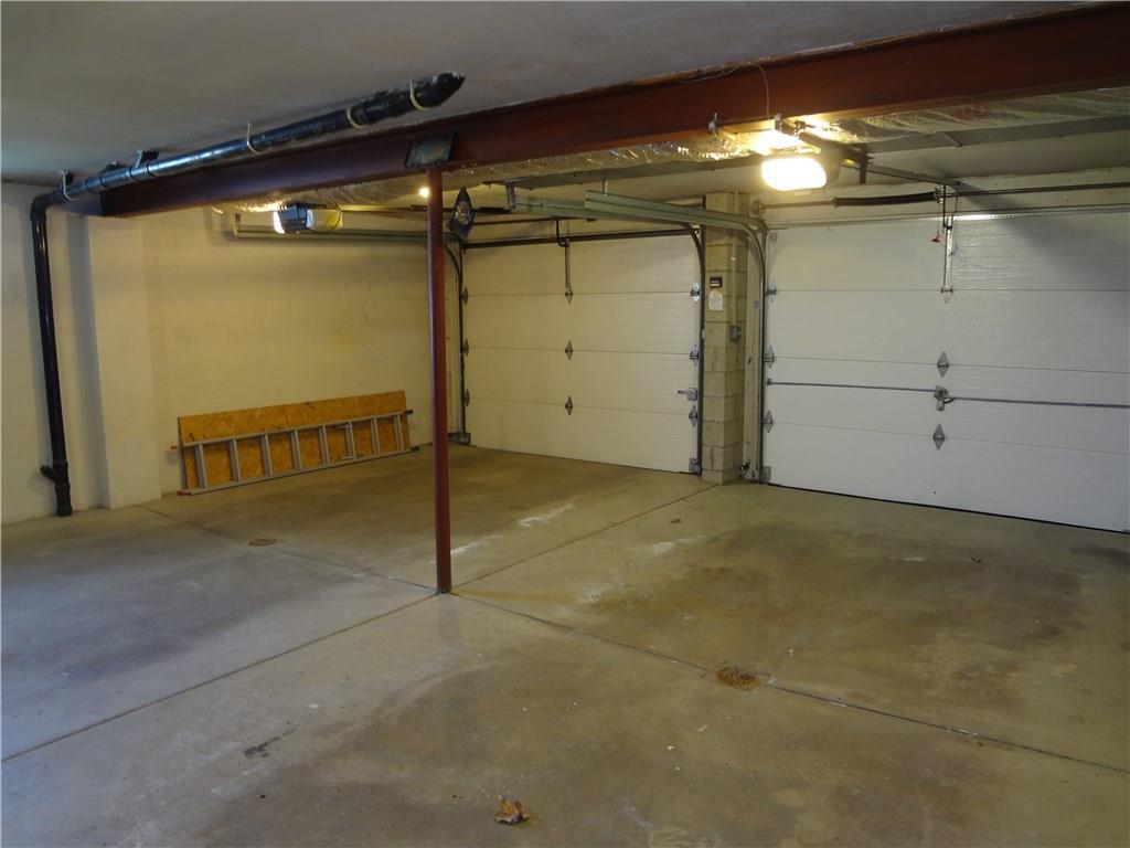 167 Town Country Road Vanderbilt, PA 15486 - Photo 21 of 25 Spacious Two-car Garage is so nice for keeping vehicles dry in inclement weather. Front of garage offers more storage or work area.